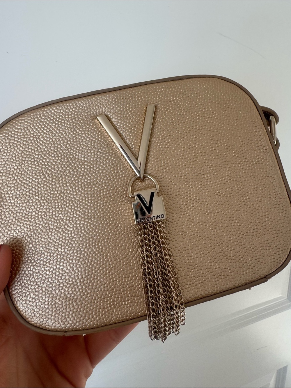 Valentino by mario valentino
 Champagne Gold Crossbody with V Tassel